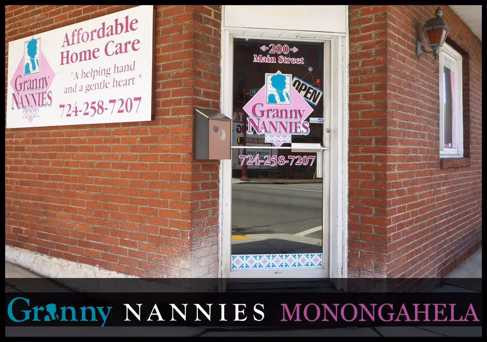 Brick storefront displaying Granny Nannies signage and glass door entrance.
