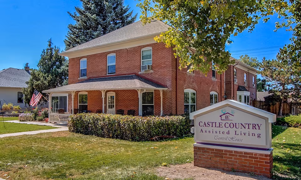 Brick Cantril House Assisted Living building with porch and front sign