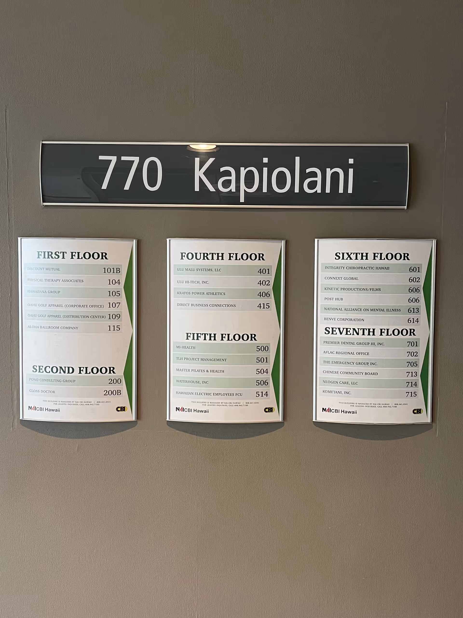 Interior wall with a large multi-floor directory sign and floor listings.