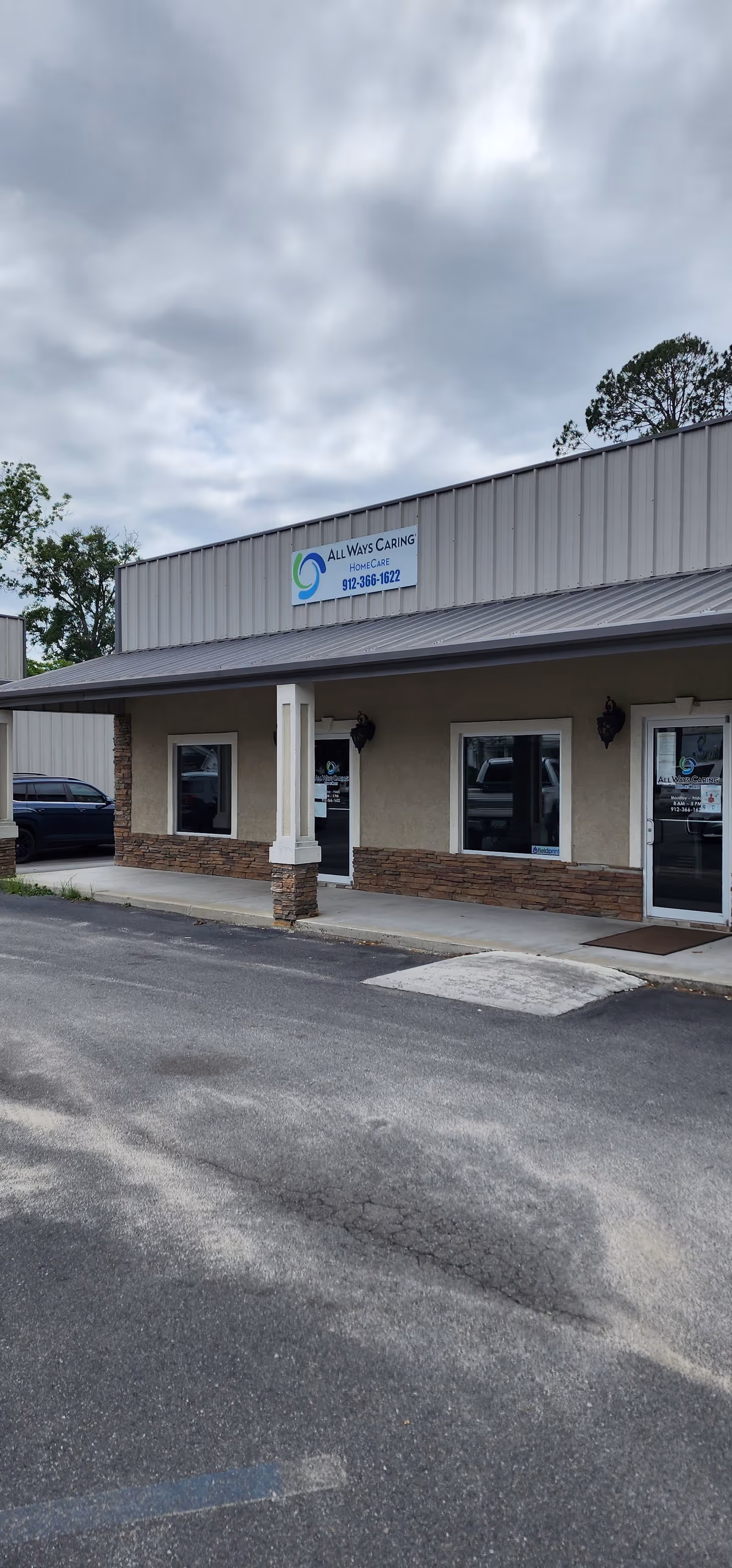 Exterior view of All Ways Caring HomeCare Baxley facility with sign and entrance