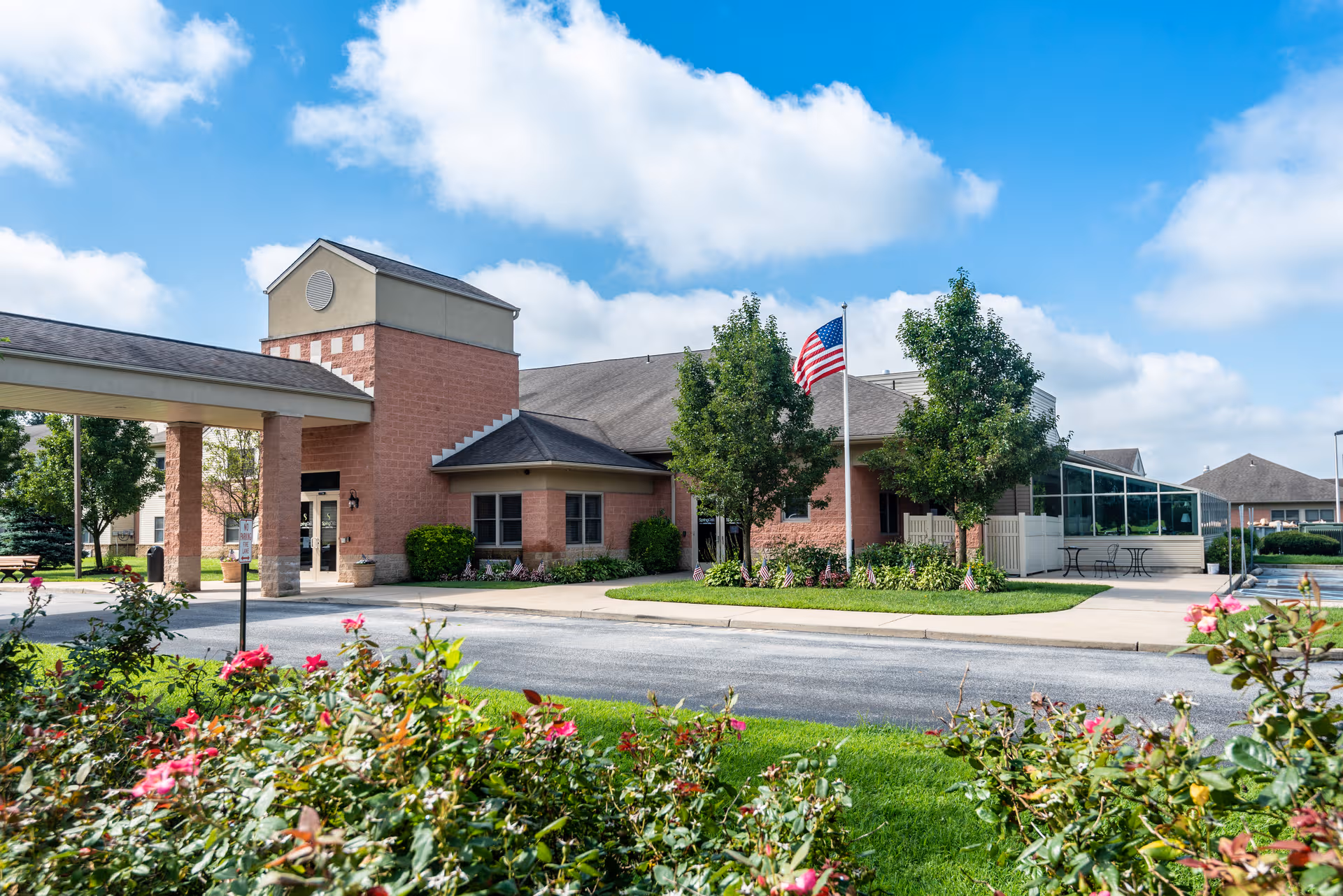 Exterior view of Spring Oak at Berlin with brick entrance and landscaped grounds.
