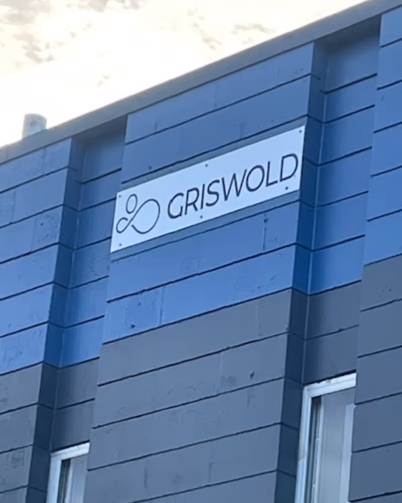Blue building exterior with Griswold sign on the facade