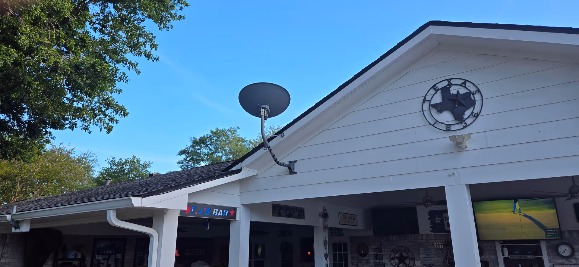 Exterior view of the Next Step Transition Center building front with satellite dish