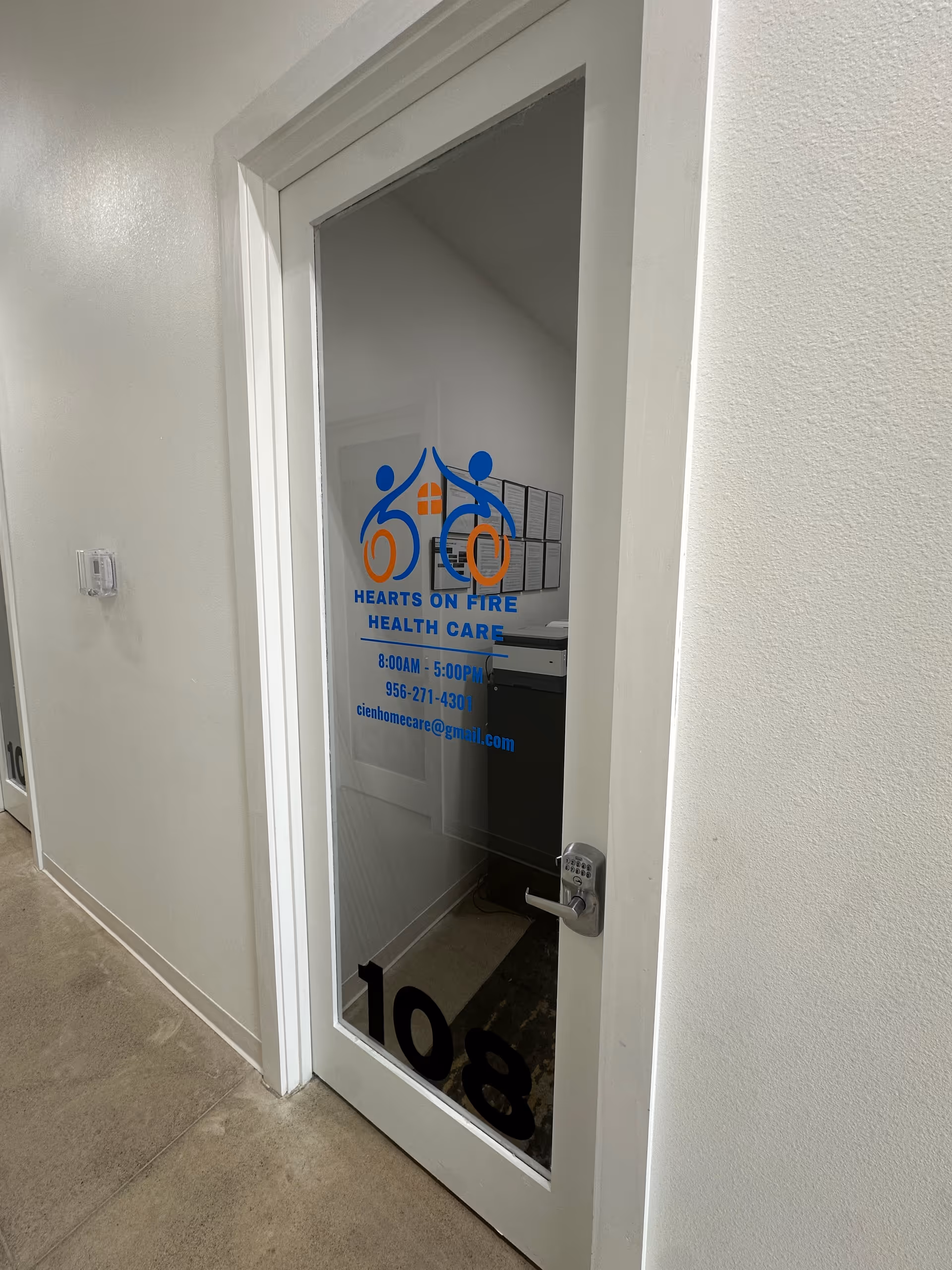 Glass door in hallway displays Hearts On Fire Health Care logo and room number 106.
