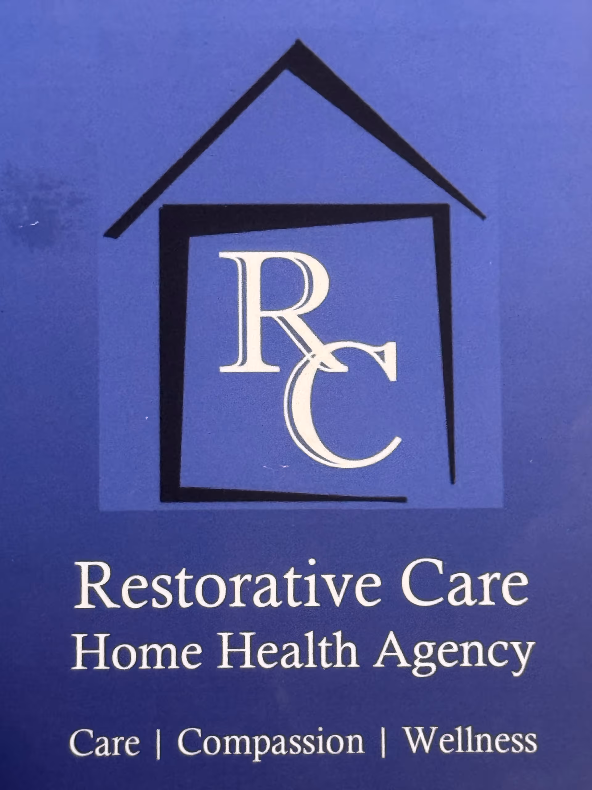 Blue exterior sign with a house logo and Restorative Care Home Health Agency text.