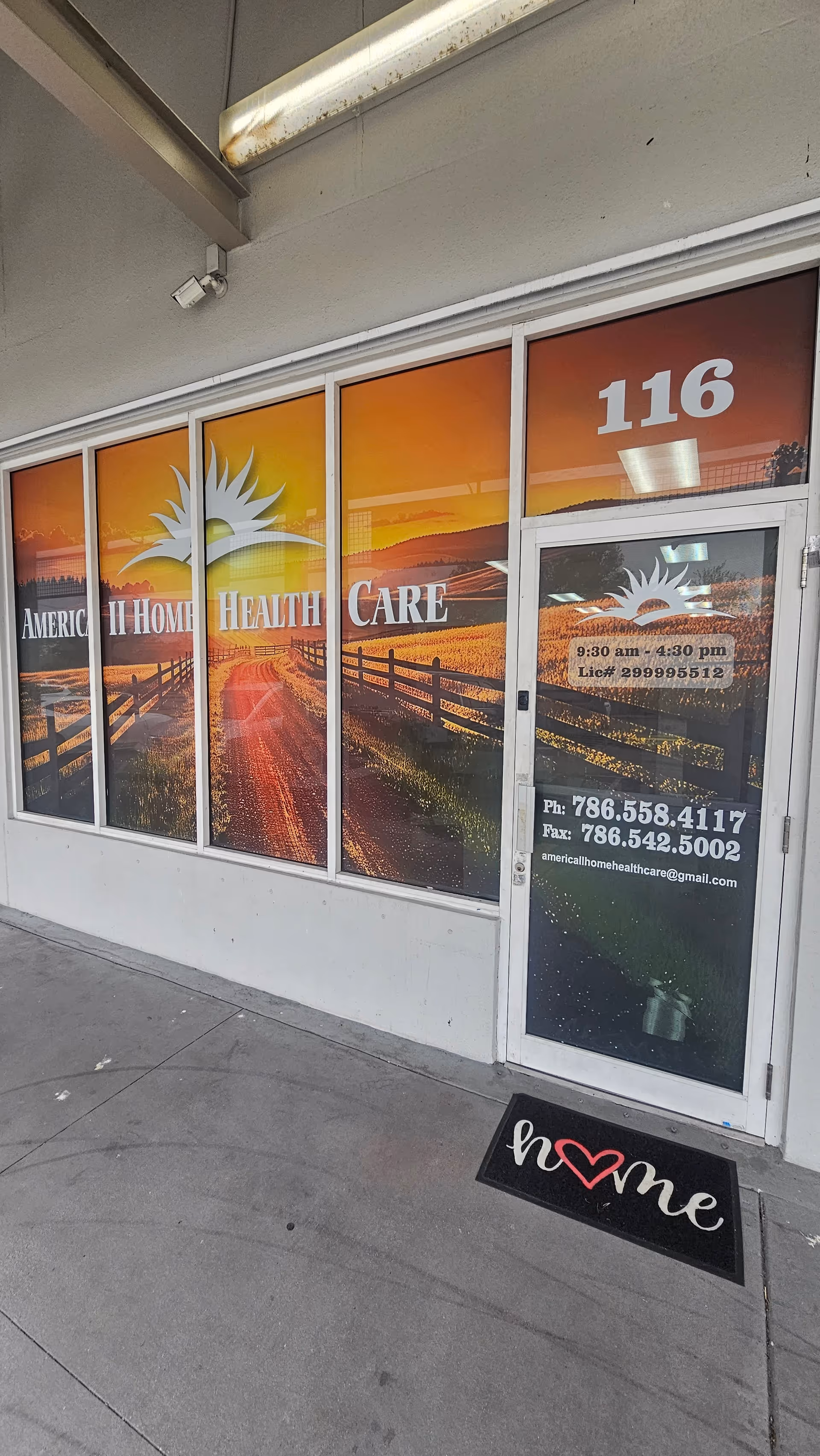 Front of America II Home Health Care storefront with colorful window graphics.