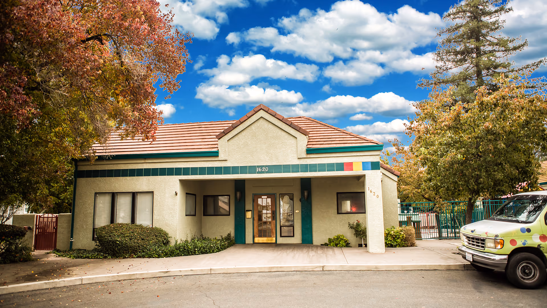 Front exterior of Genesis Behavior Center building with teal trim and entrance.