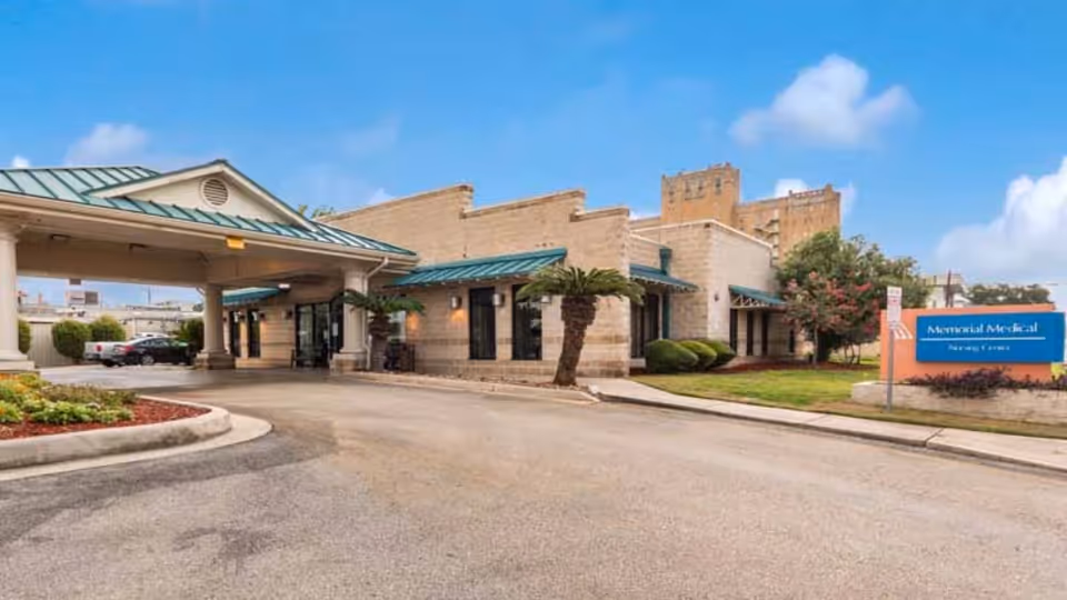 Exterior view of Memorial Medical Nursing Center with driveway and entrance canopies
