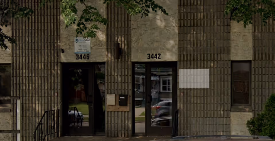 Facade of a senior care building with two glass doors and street numbers 3442 and 3446.