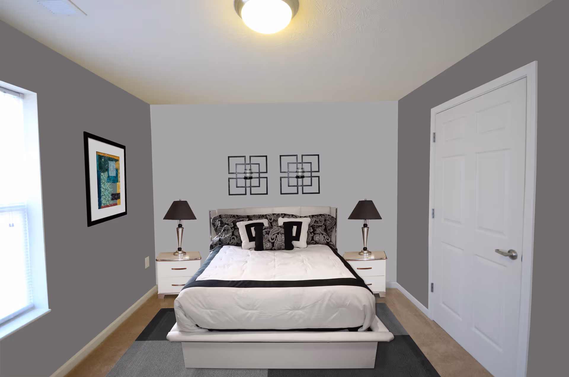 A neatly made bedroom in a senior living facility with a bed, nightstands, and lamps.