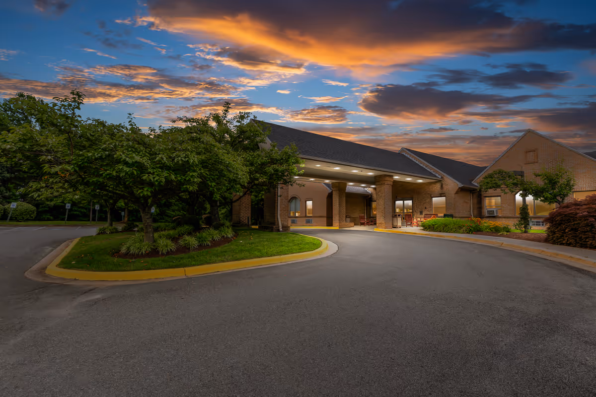 Exterior view of Oak Manor Center for Rehabilitation and Healthcare entrance with curved driveway.