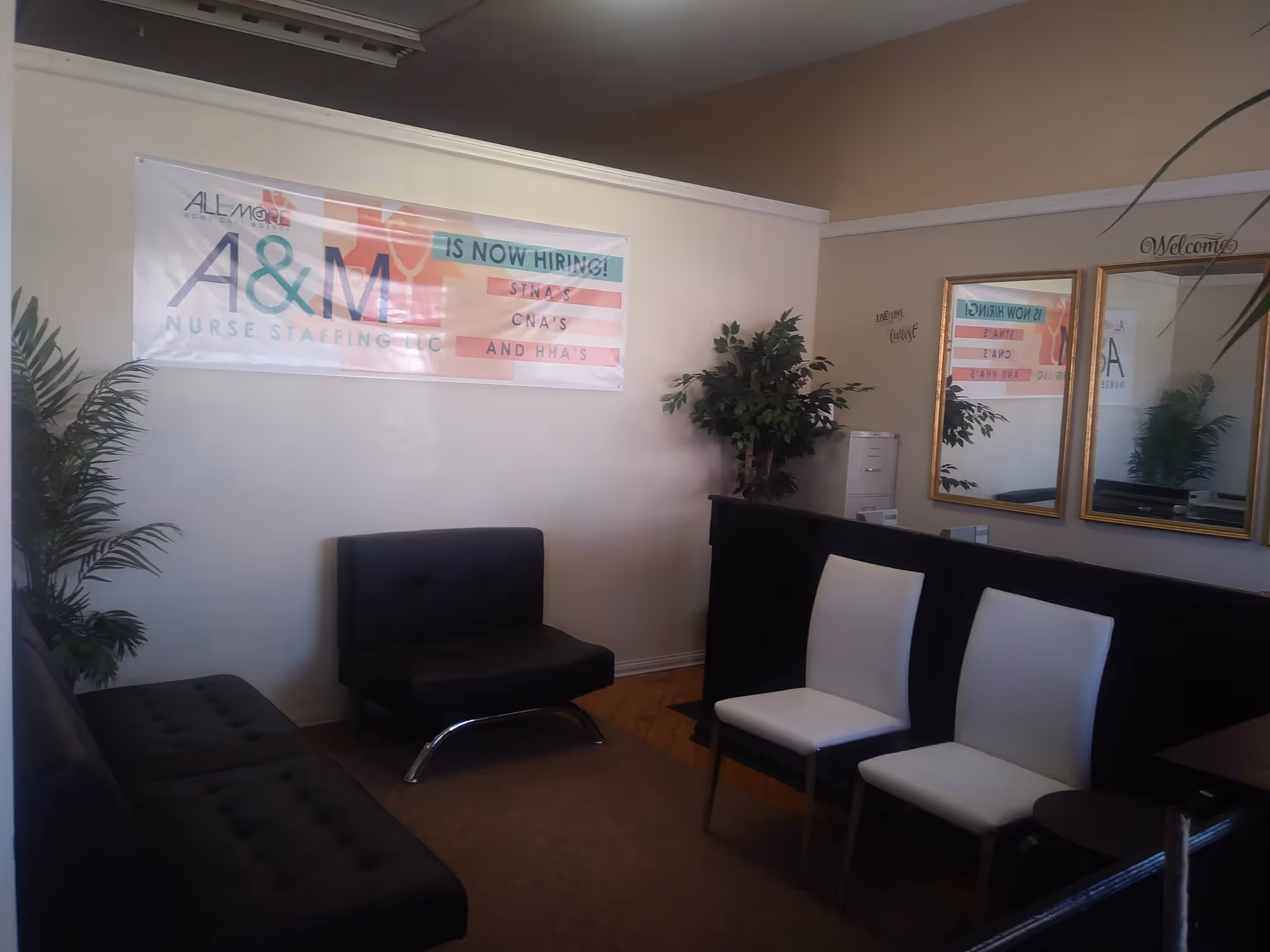 Interior waiting area of All and More Home Health Agency LLC with chairs and plants.