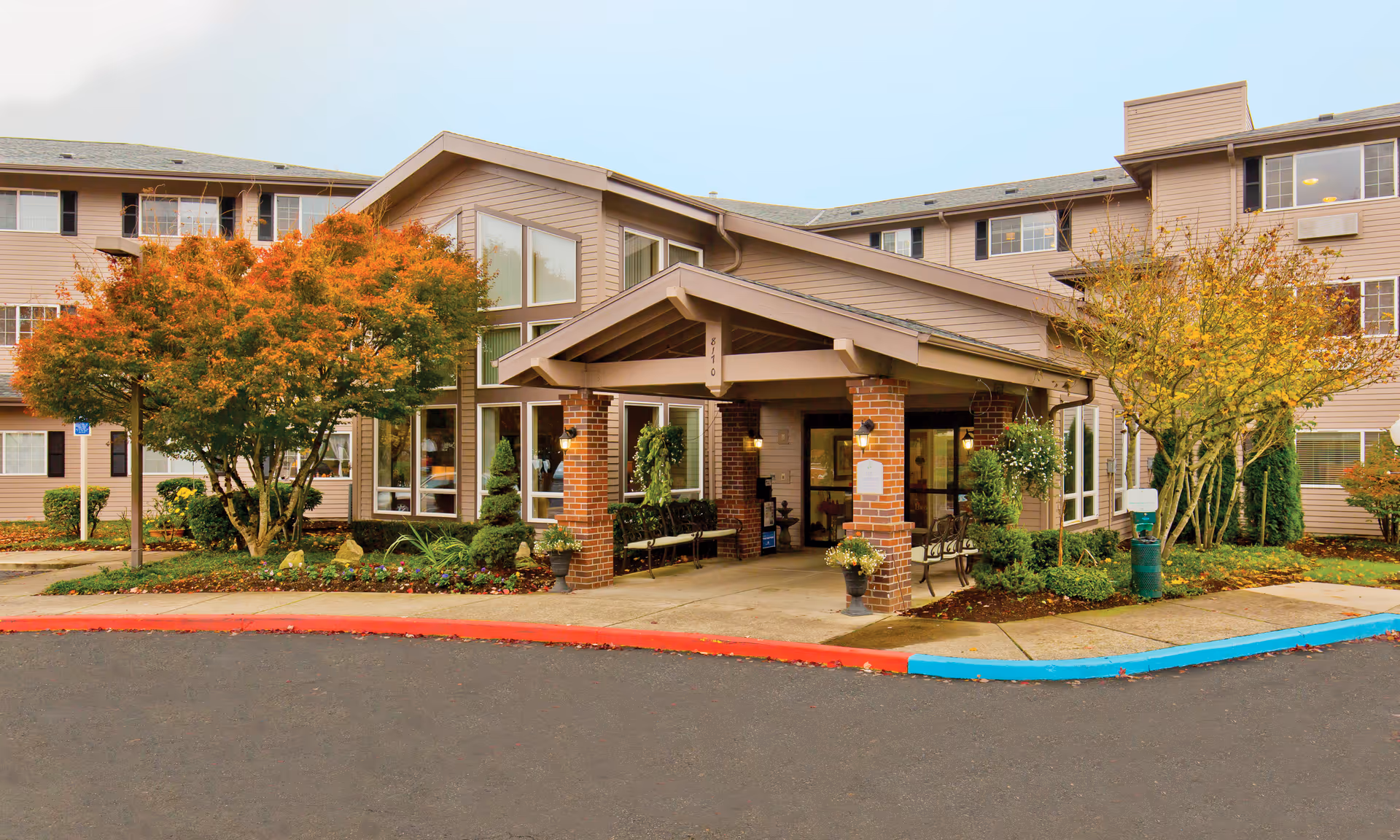 Brookdale Wilsonville senior living facility exterior with covered entrance and landscaped surroundings.