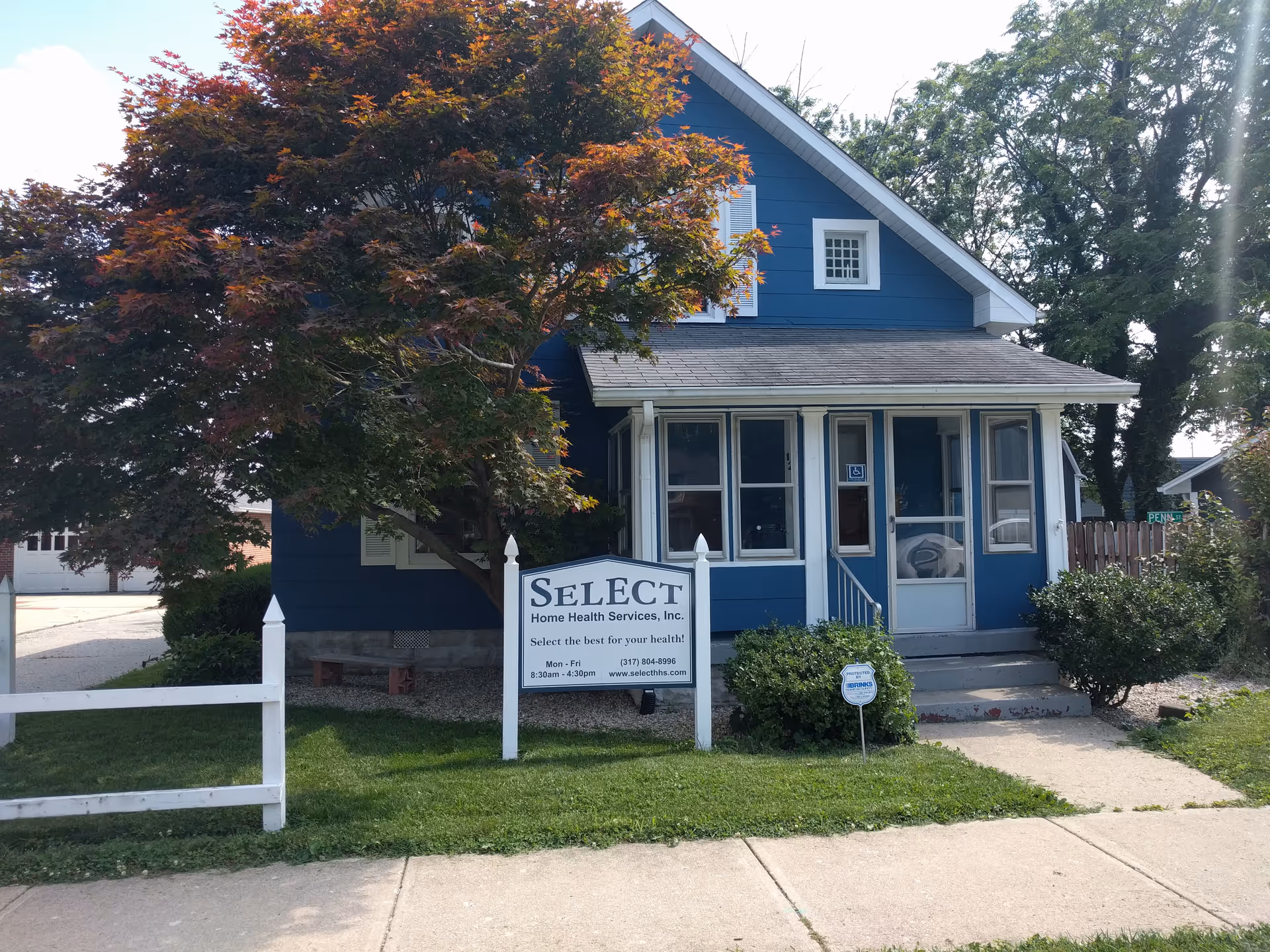 Blue house-style building with front porch and a SELECT Home Health Services sign.