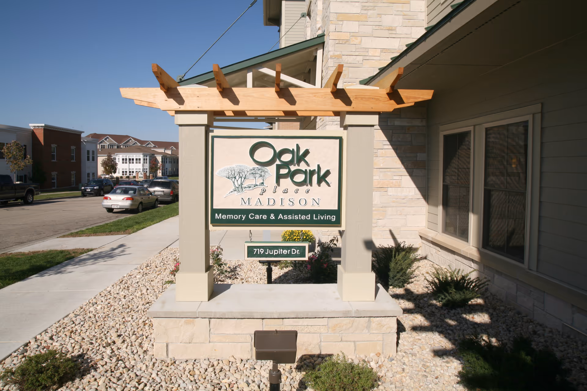 Exterior view of Oak Park Place sign and entrance with landscaped rocks