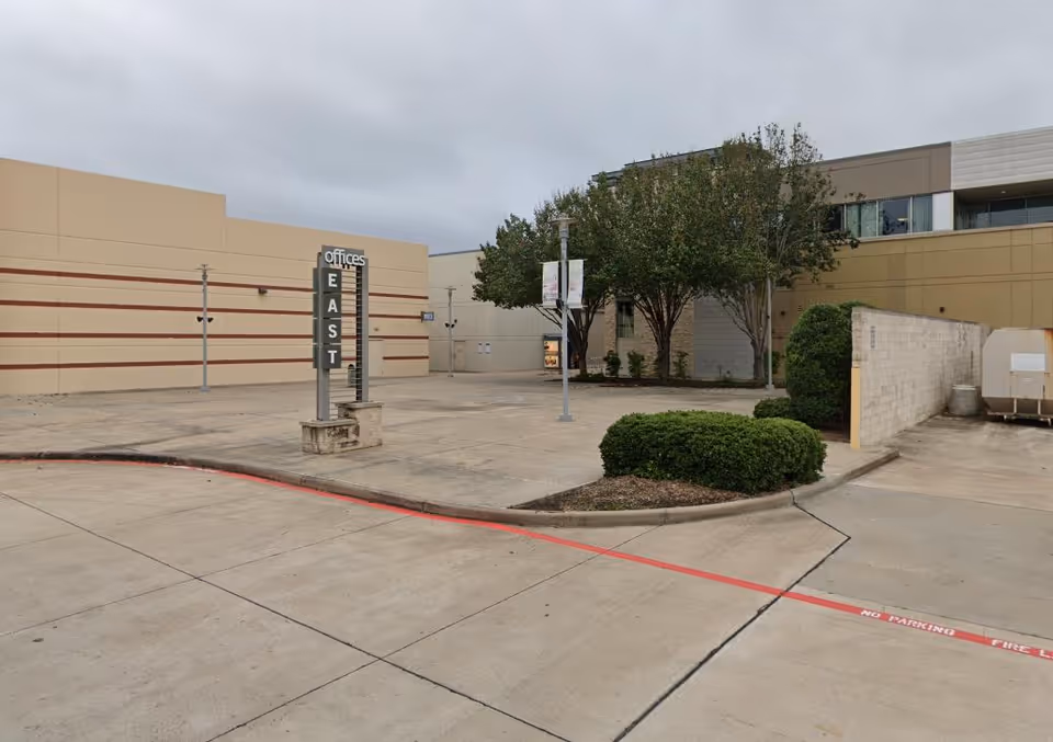 Exterior view of AngelFaith Home Care facility with a parking lot and landscaping