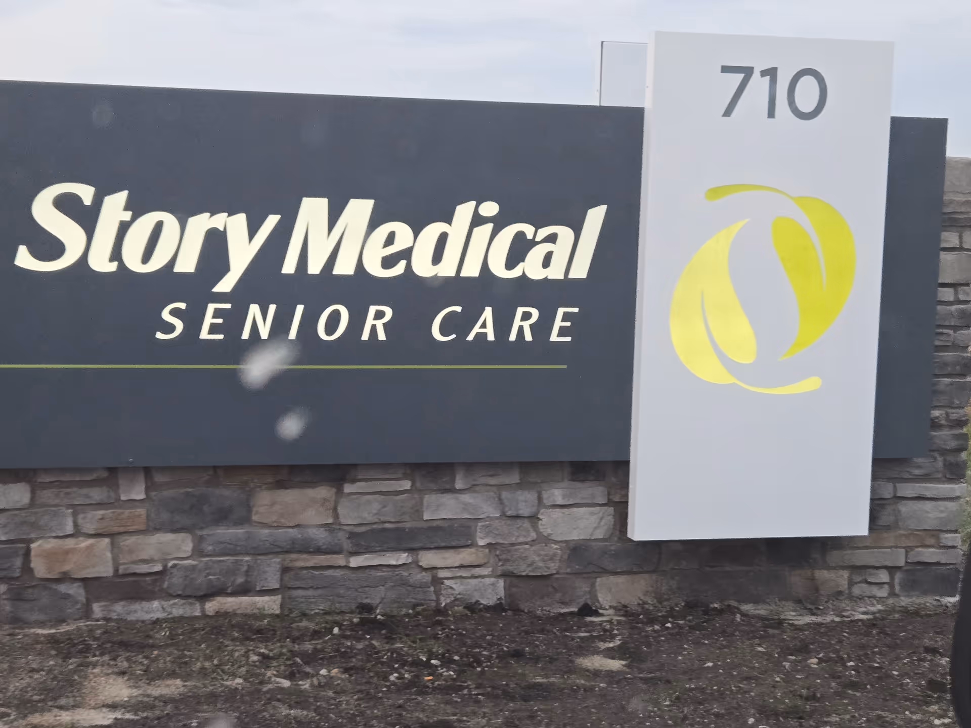 Outdoor front sign for Story Medical Center Senior Care with 710 and logo