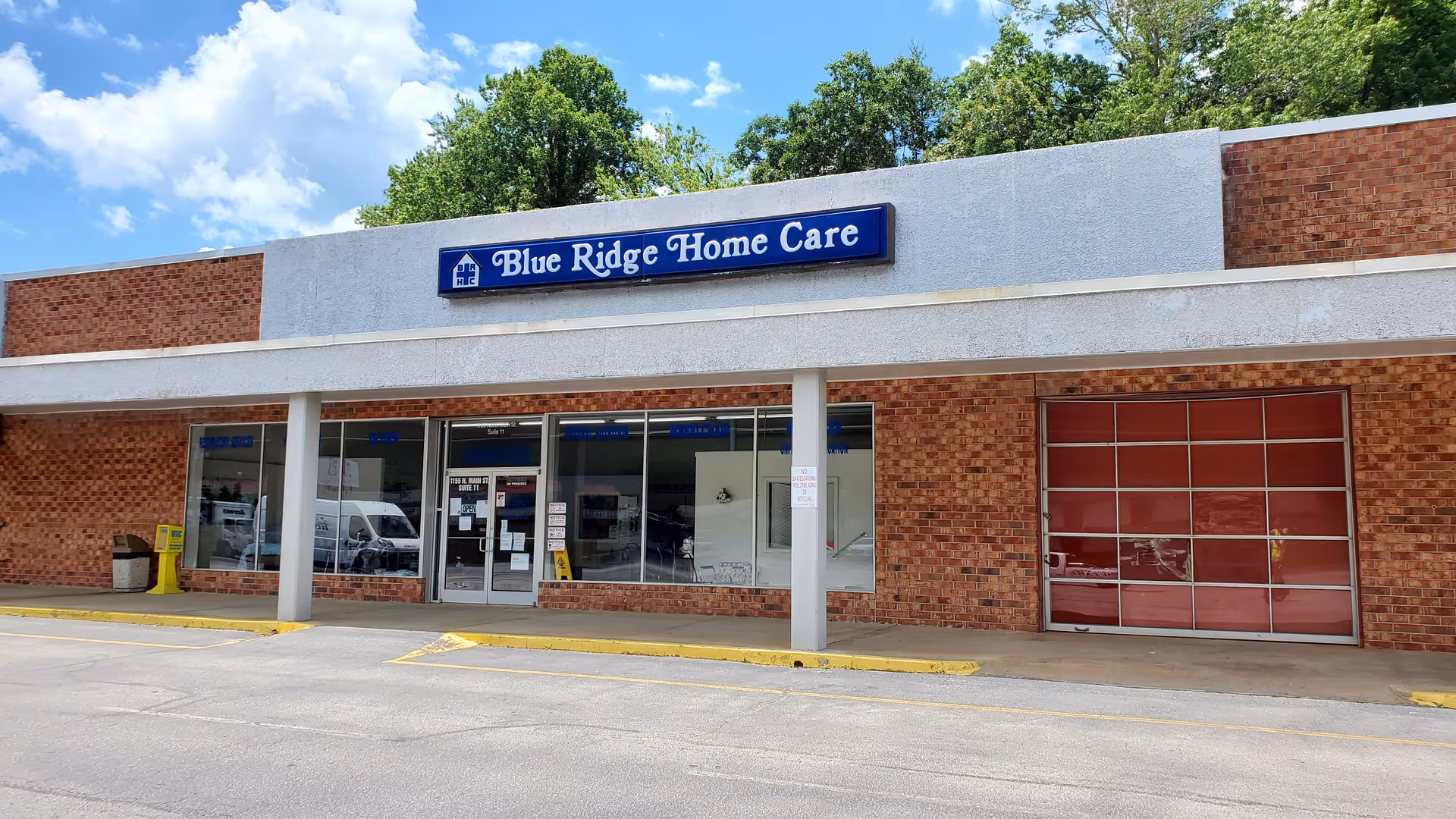 Front view of Blue Ridge Home Care building with brick exterior and glass entry doors.