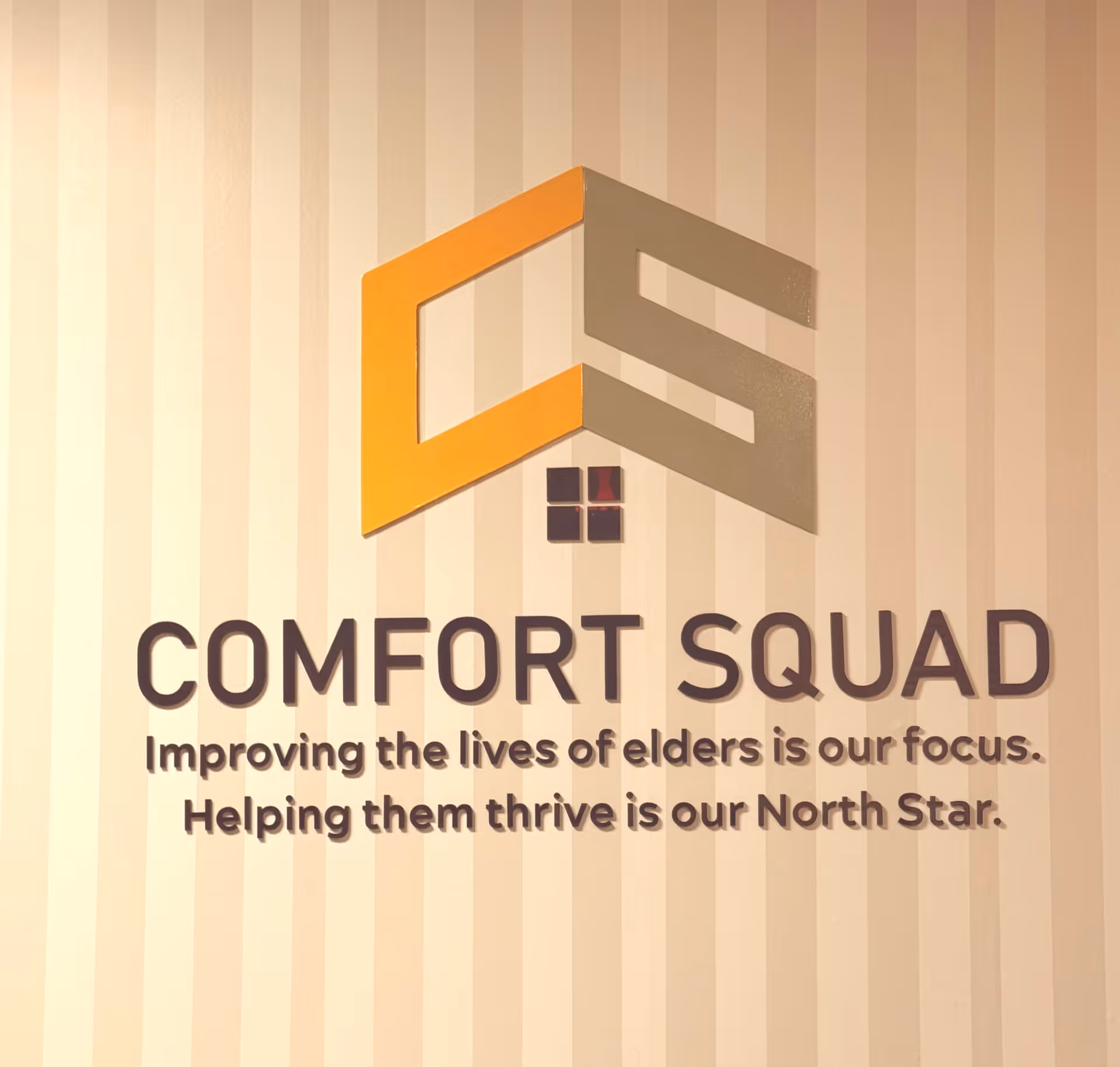 Interior wall displaying the Comfort Squad logo and mission statement.