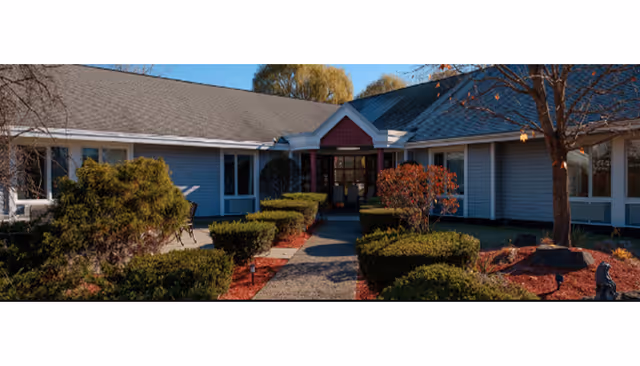 Exterior view of The Eliot at Catskill entrance with landscaped walkway.