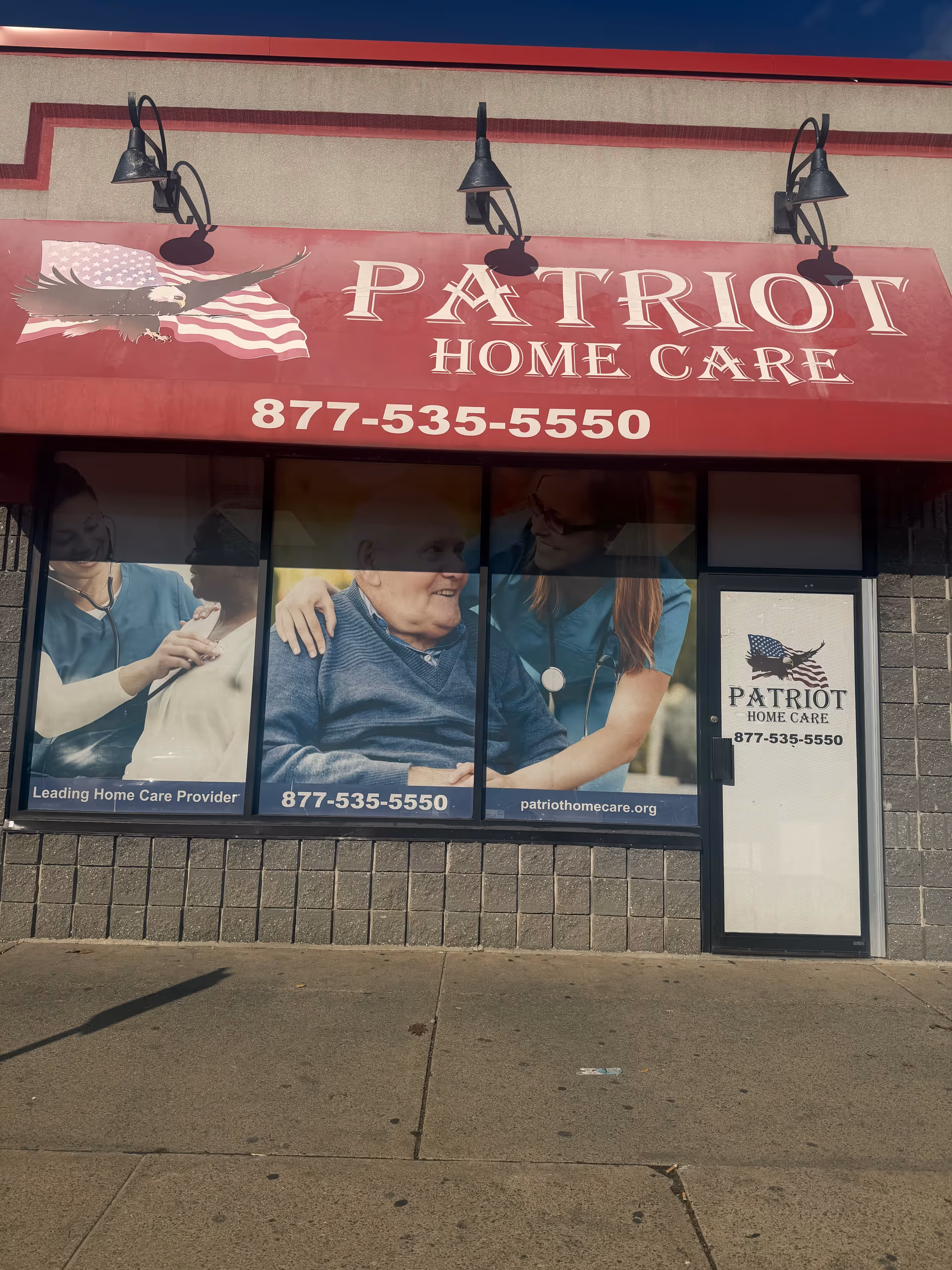 Patriot Home Care storefront with large sign and caregiver-elderly photos