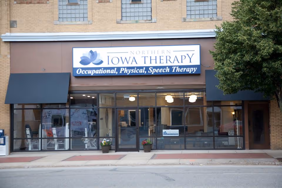 Exterior storefront showing Northern Iowa Therapy with Occupational, Physical, and Speech Therapy signage.