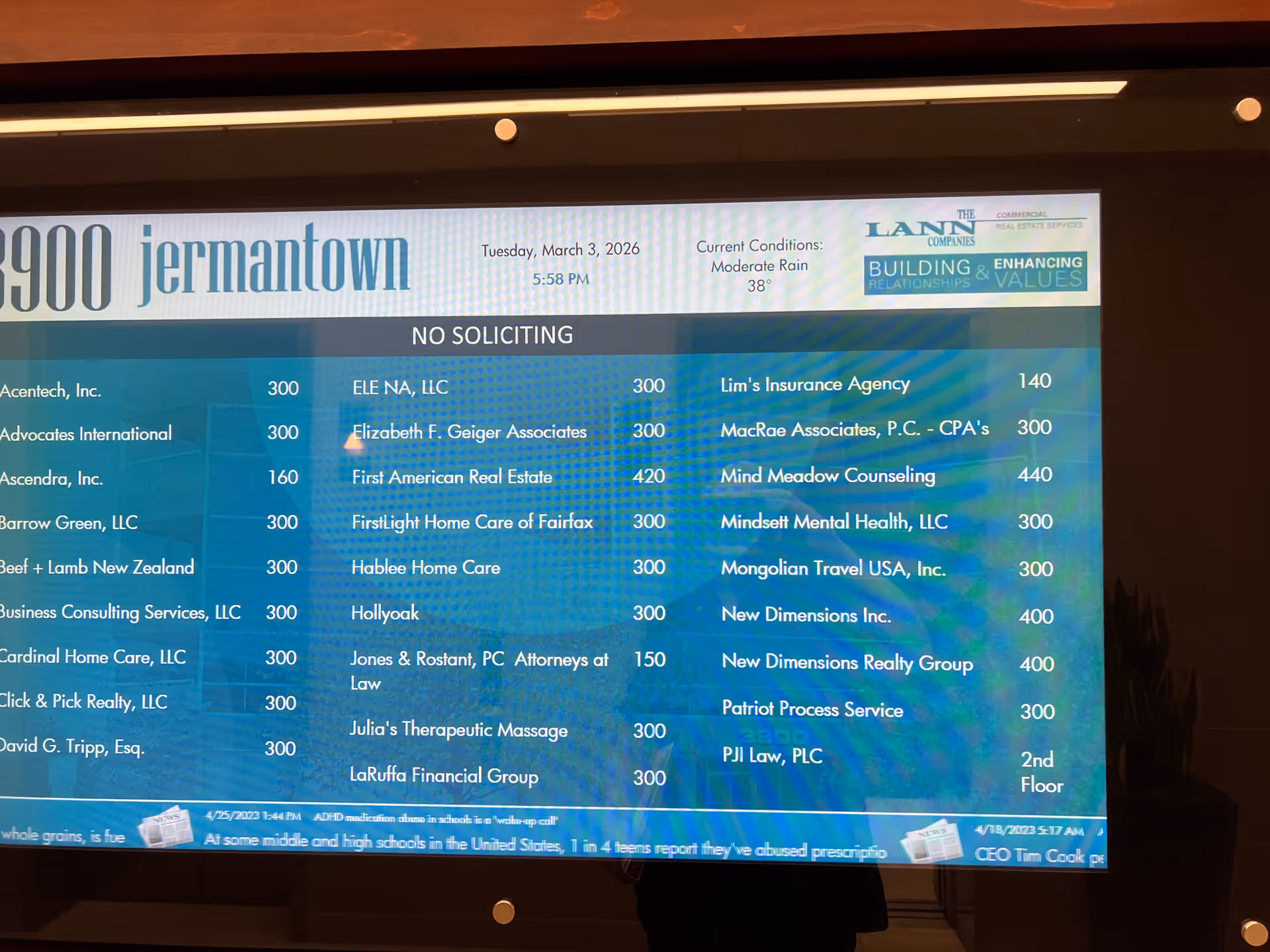 Lobby digital directory screen listing companies; 'FirstLight Home Care of Fairfax' visible.