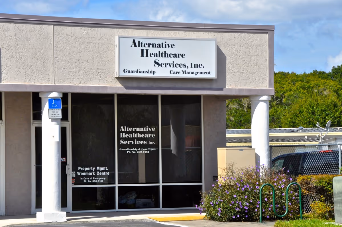 Exterior view of Alternative Healthcare Services, Inc. building with sign and front windows.