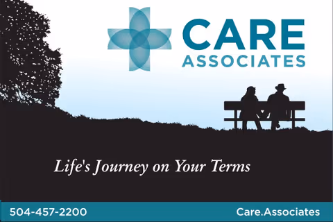Silhouetted elderly couple sitting on a bench beneath the Care Associates logo.