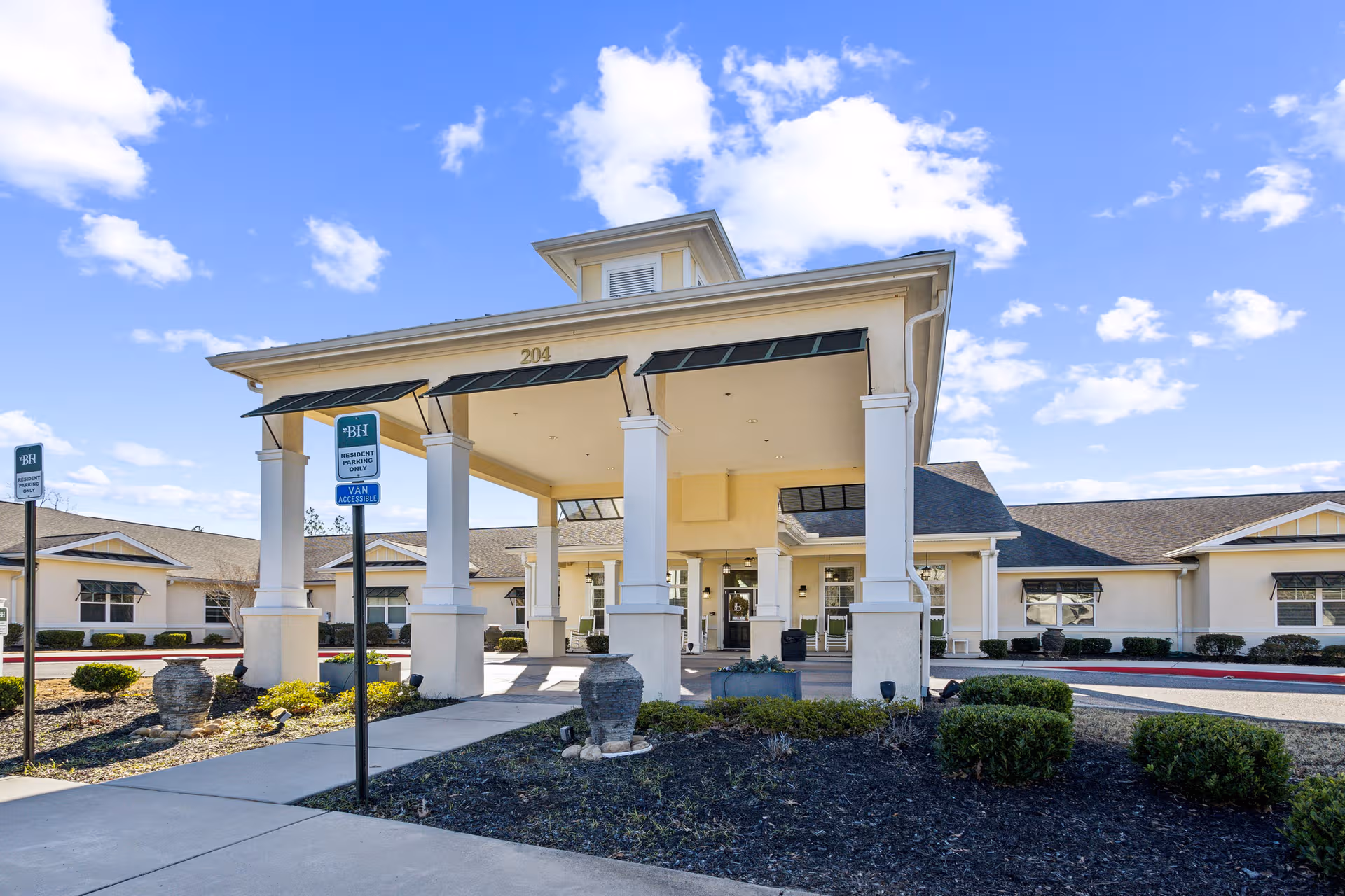 Front exterior of Barclay House of Augusta with a covered entrance and landscaping.