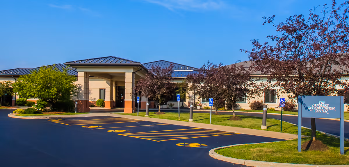 Exterior view of Autumn View Health Care Facility showing entrance and accessible parking.