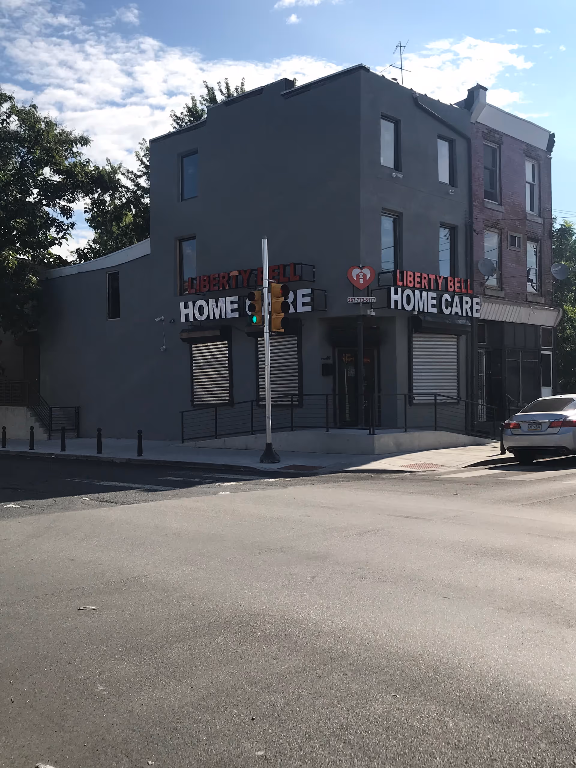 Corner building with Liberty Bell Home Care signage at a street intersection.
