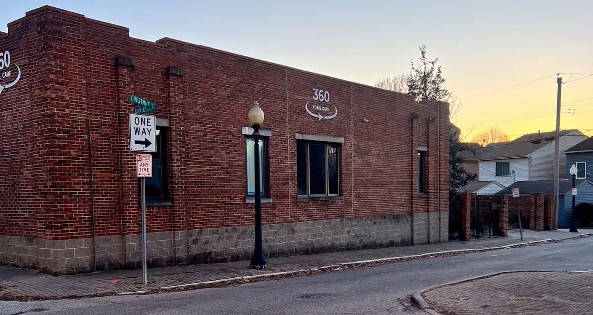 Brick senior care building exterior with 360 Total Care sign on the street.