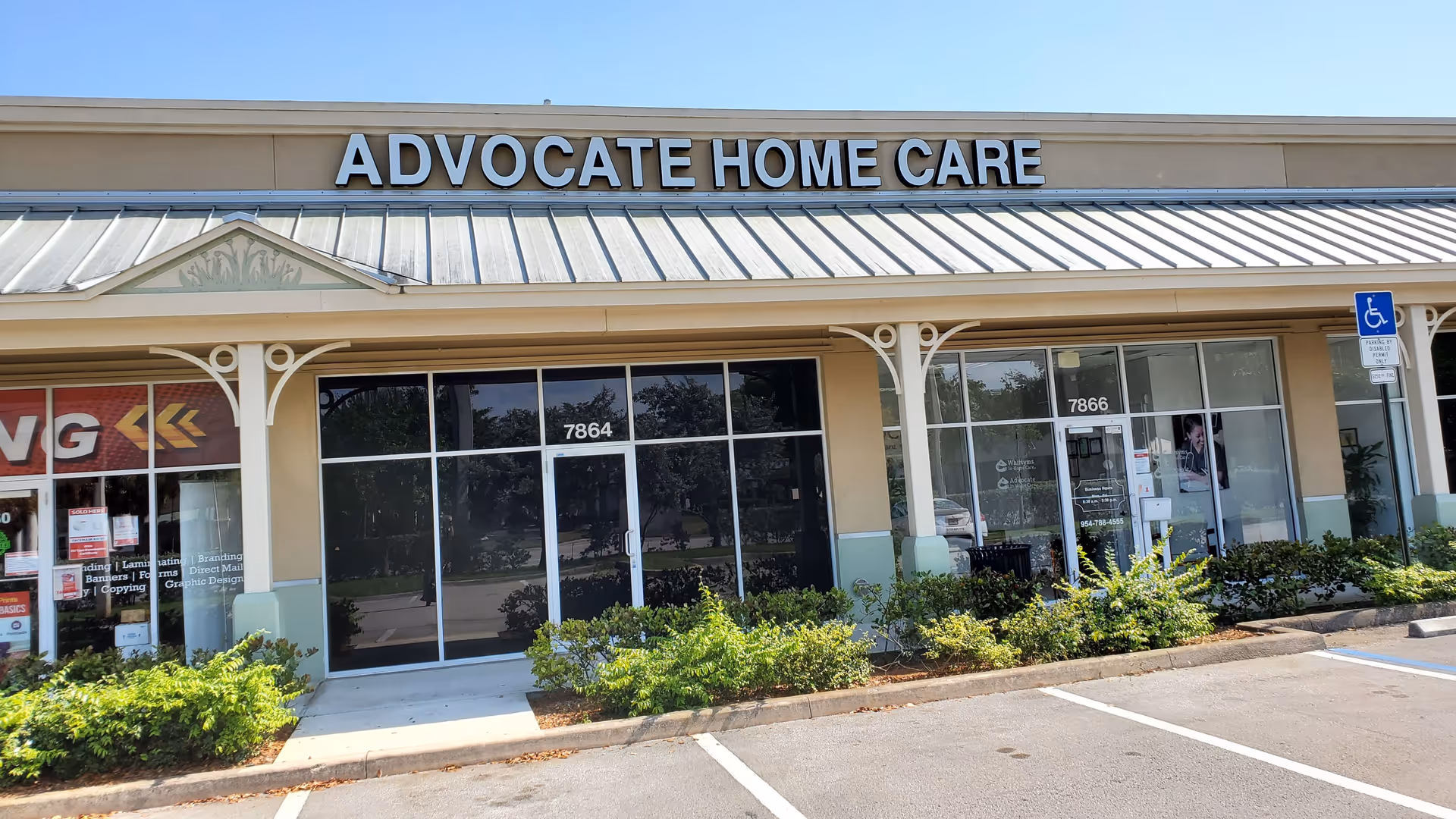 Front exterior of Advocate Home Care storefront with large sign and glass doors.