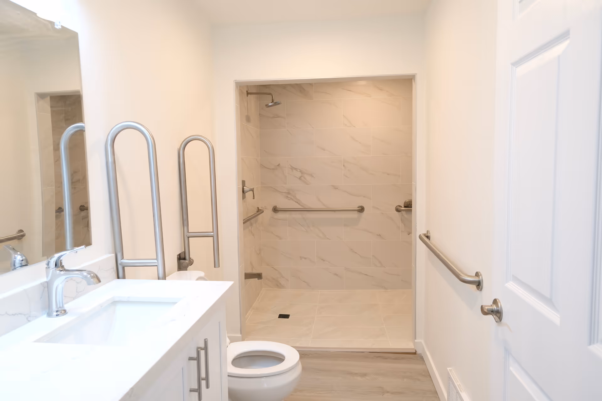 Accessible bathroom in Happy Life AFH with grab bars and walk-in shower.