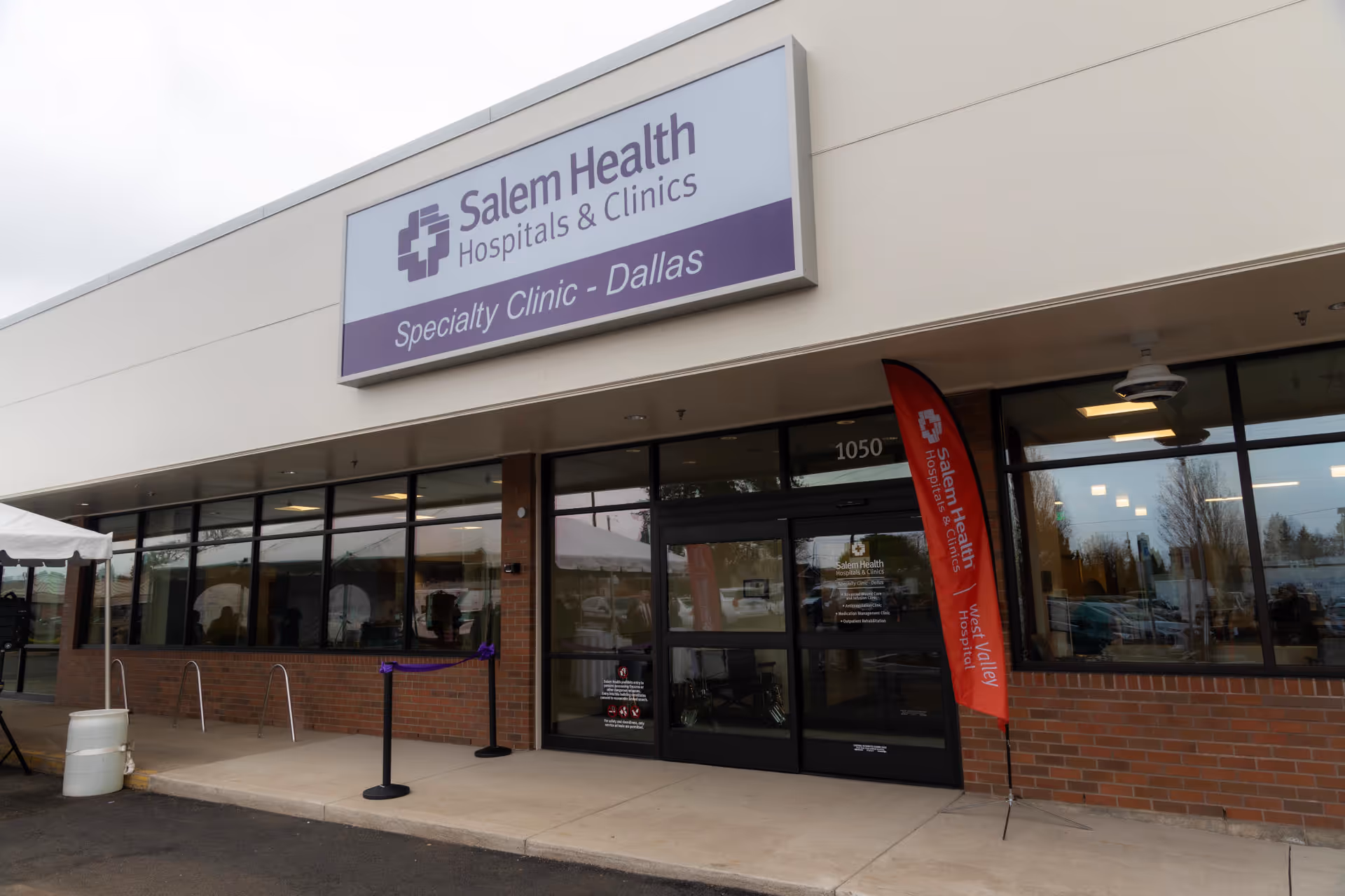 Exterior view of Salem Health Specialty Clinic in Dallas with glass doors and sign.
