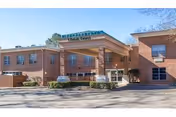 Front exterior of Talladega Healthcare Center, a brick building with a covered entrance.