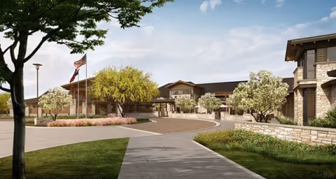 Exterior view of Avanti Senior Living at Towne Lake with entrance and landscaping