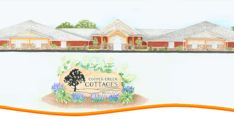 Exterior view of a senior care building with landscaped entrance and sign.