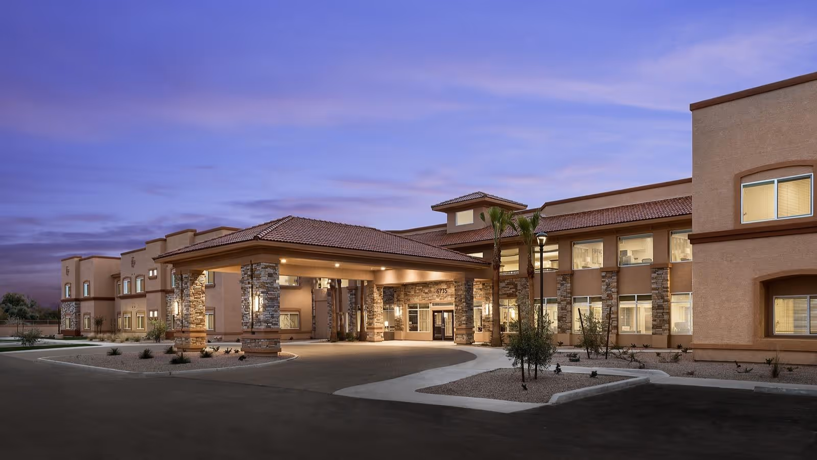 Twilight exterior of MorningStar Senior Living at Golden Ridge with a covered entrance.