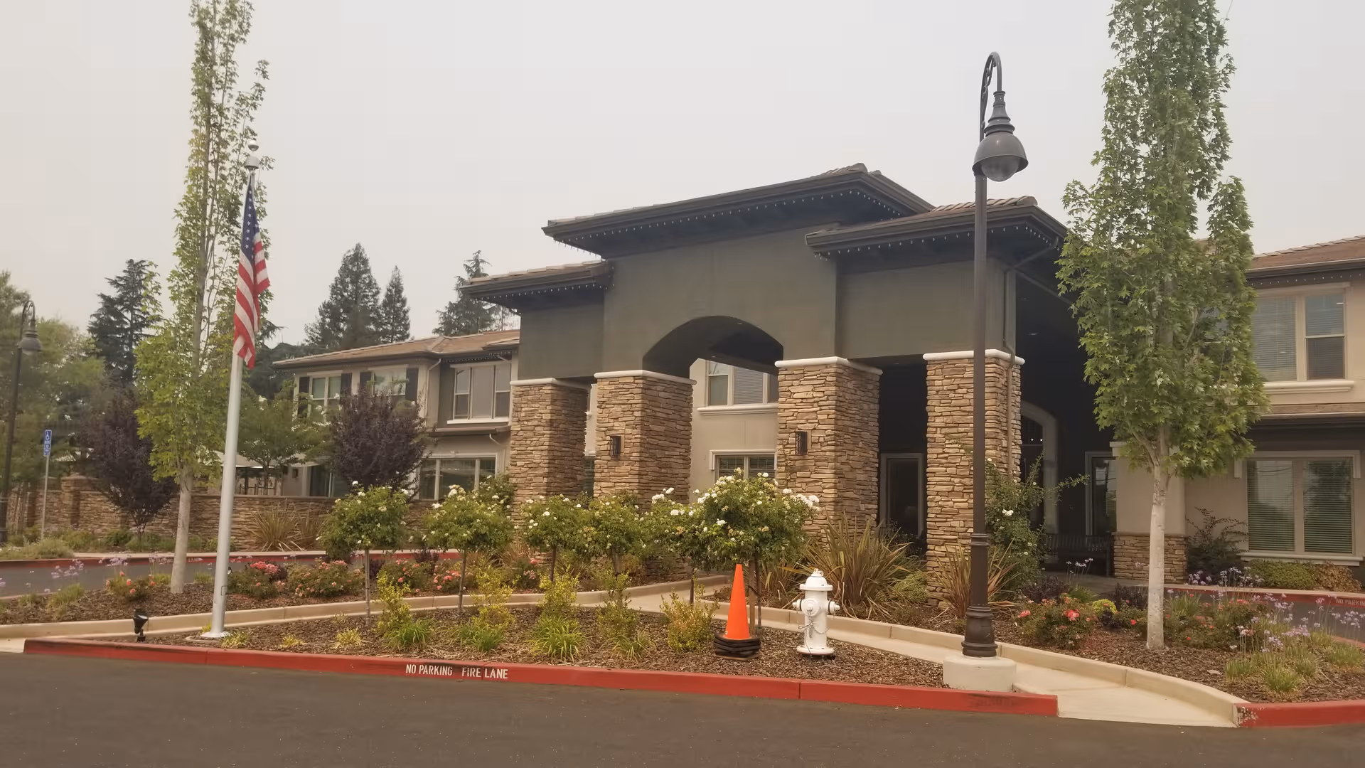 Front view of Oakmont of El Dorado Hills with stone columns and landscaped entry.