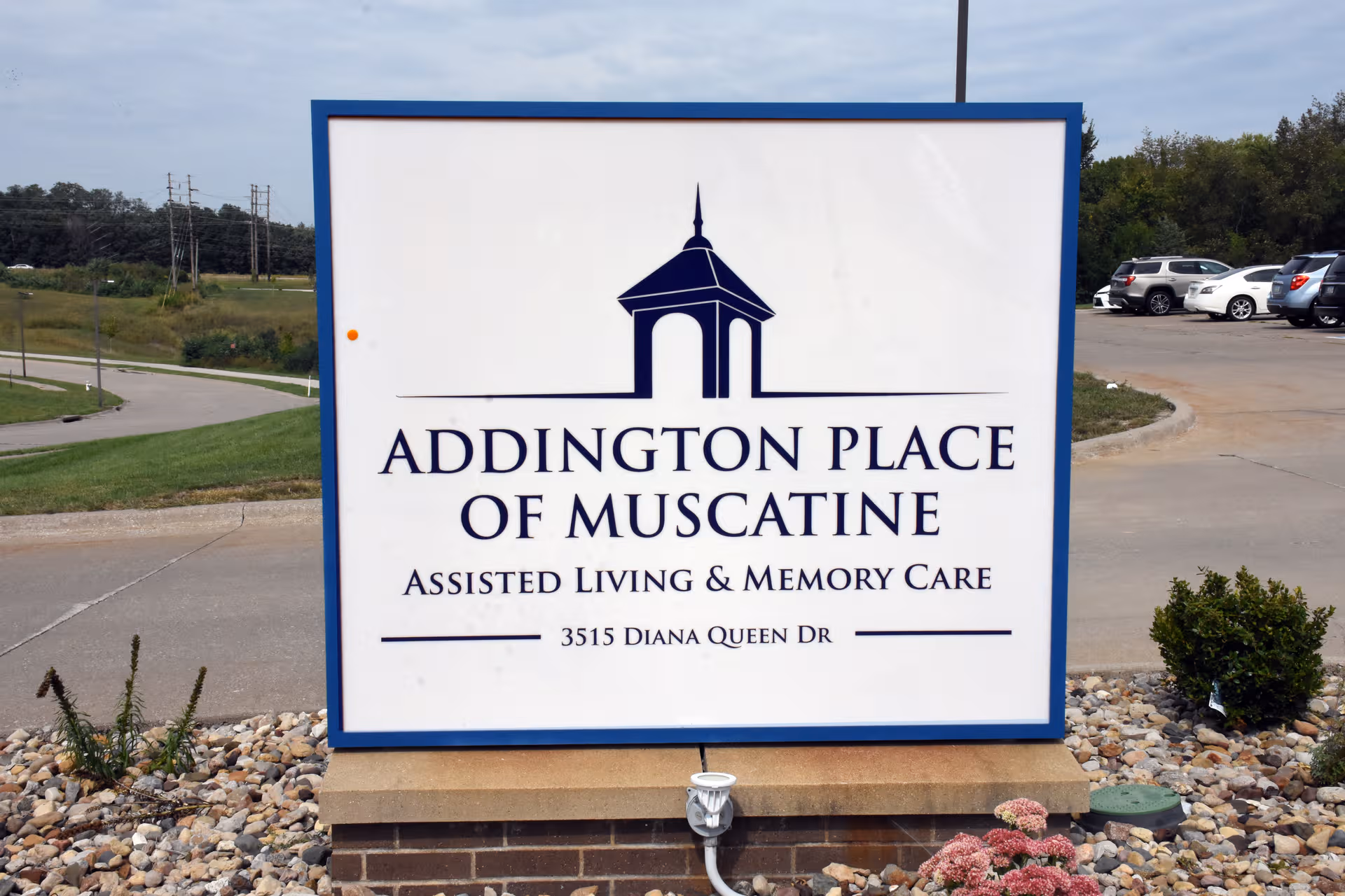 Large outdoor sign for Addington Place of Muscatine advertising assisted living and memory care