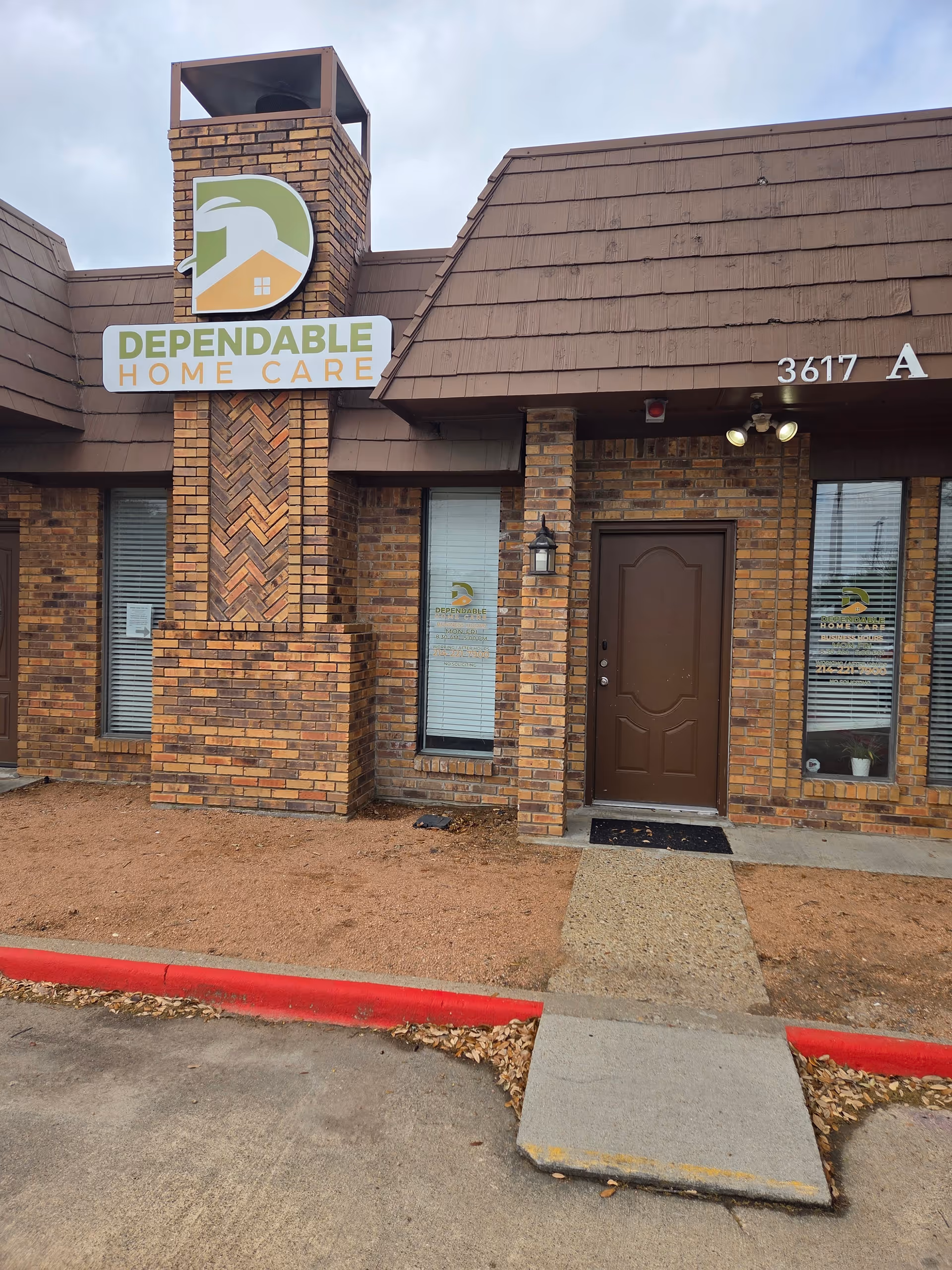 Front view of a brick Dependable Home Care facility with entrance.