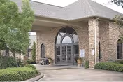 Front entrance of Friendship Haven Healthcare and Rehabilitation Center with brick exterior and landscaping.