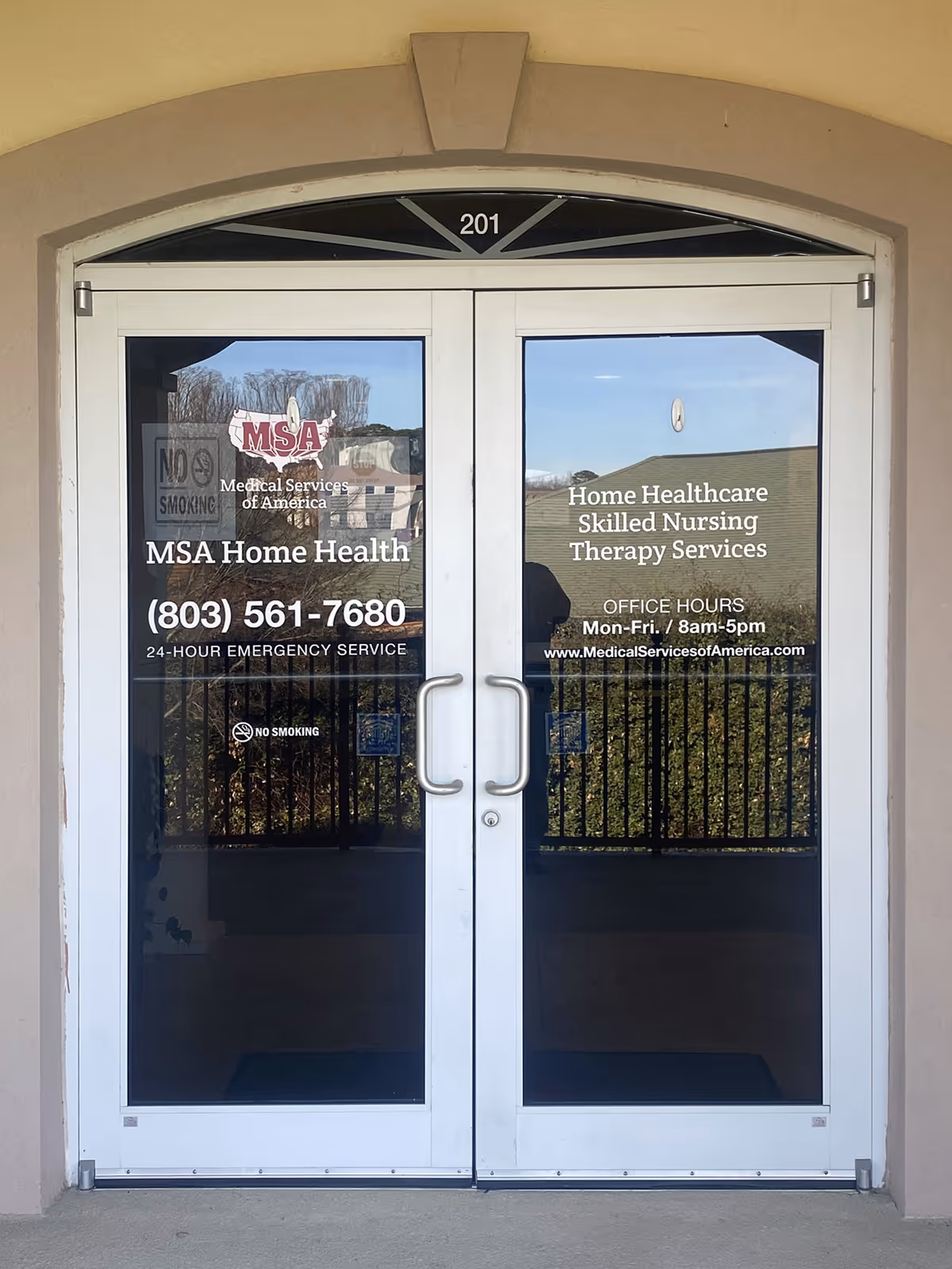 Double glass doors display MSA Home Health signage and hours at the building entrance.