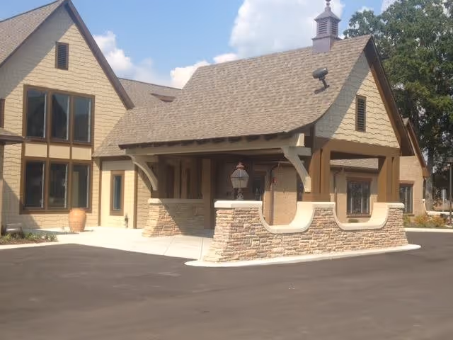 Front exterior view of Westminster of Decatur building with stone accents and covered entrance.