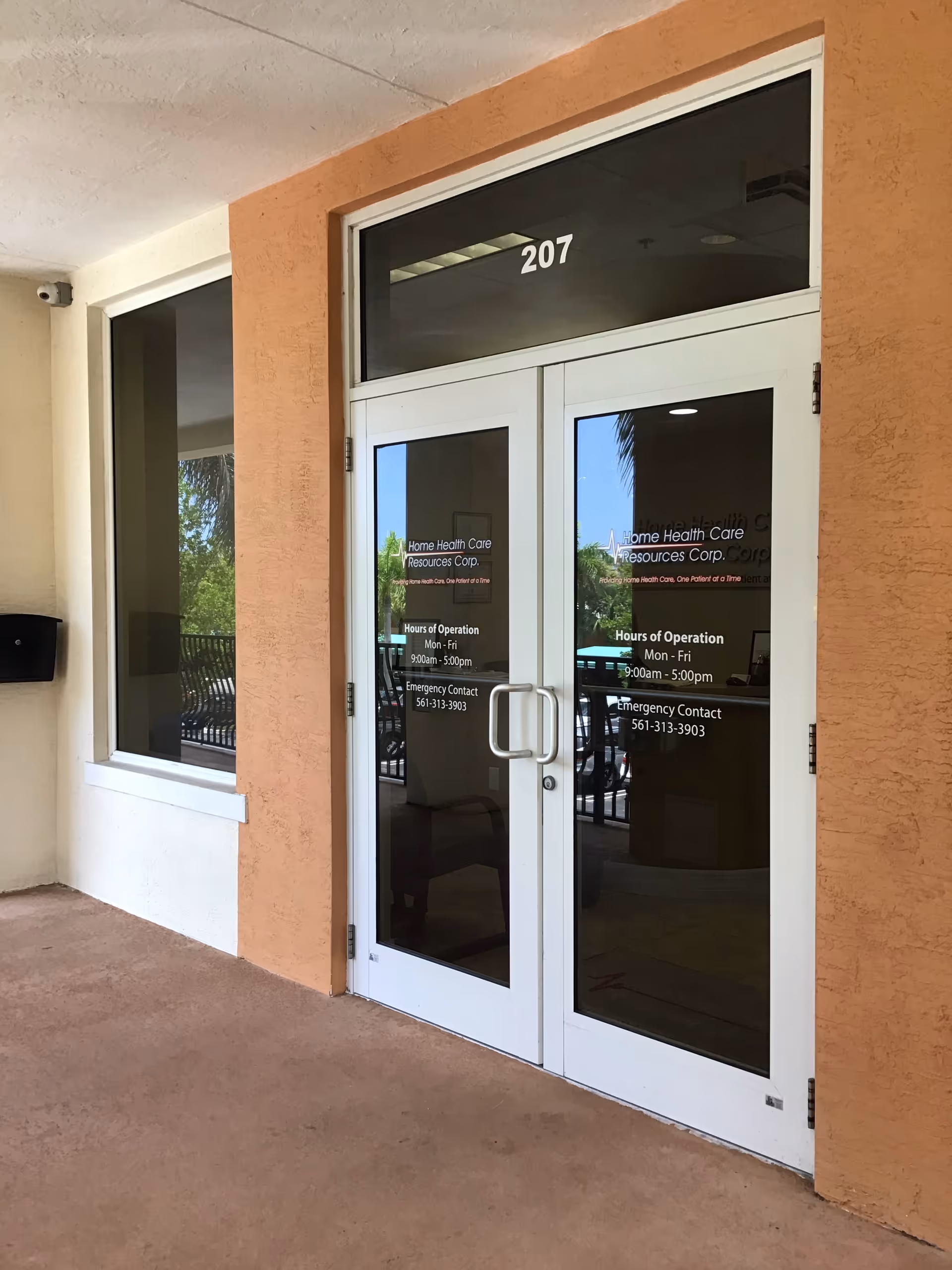Glass double doors labeled 207 at the entrance of Home Health Care Resources Corp.