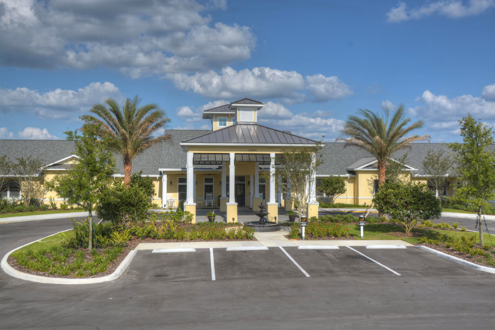 Exterior front view of Benton House of Clermont with entrance, parking, and landscaping.