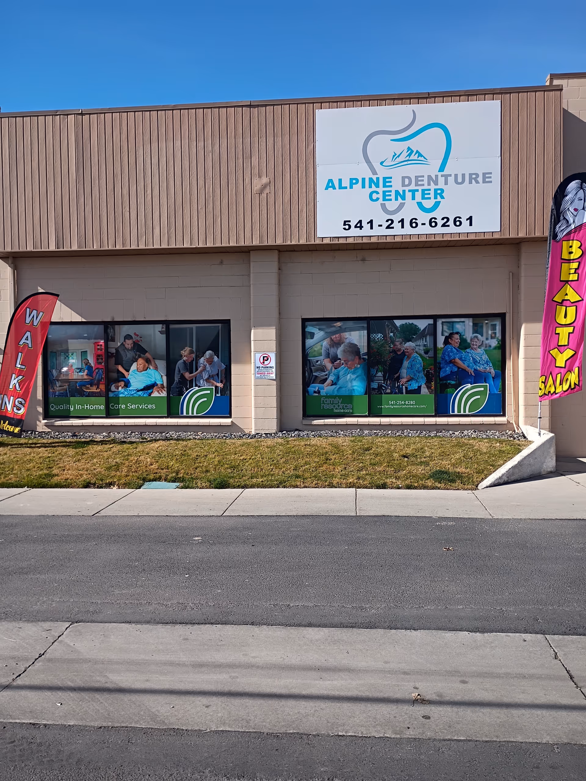 Exterior view of Alpine Denture Center storefront with sign and window graphics.
