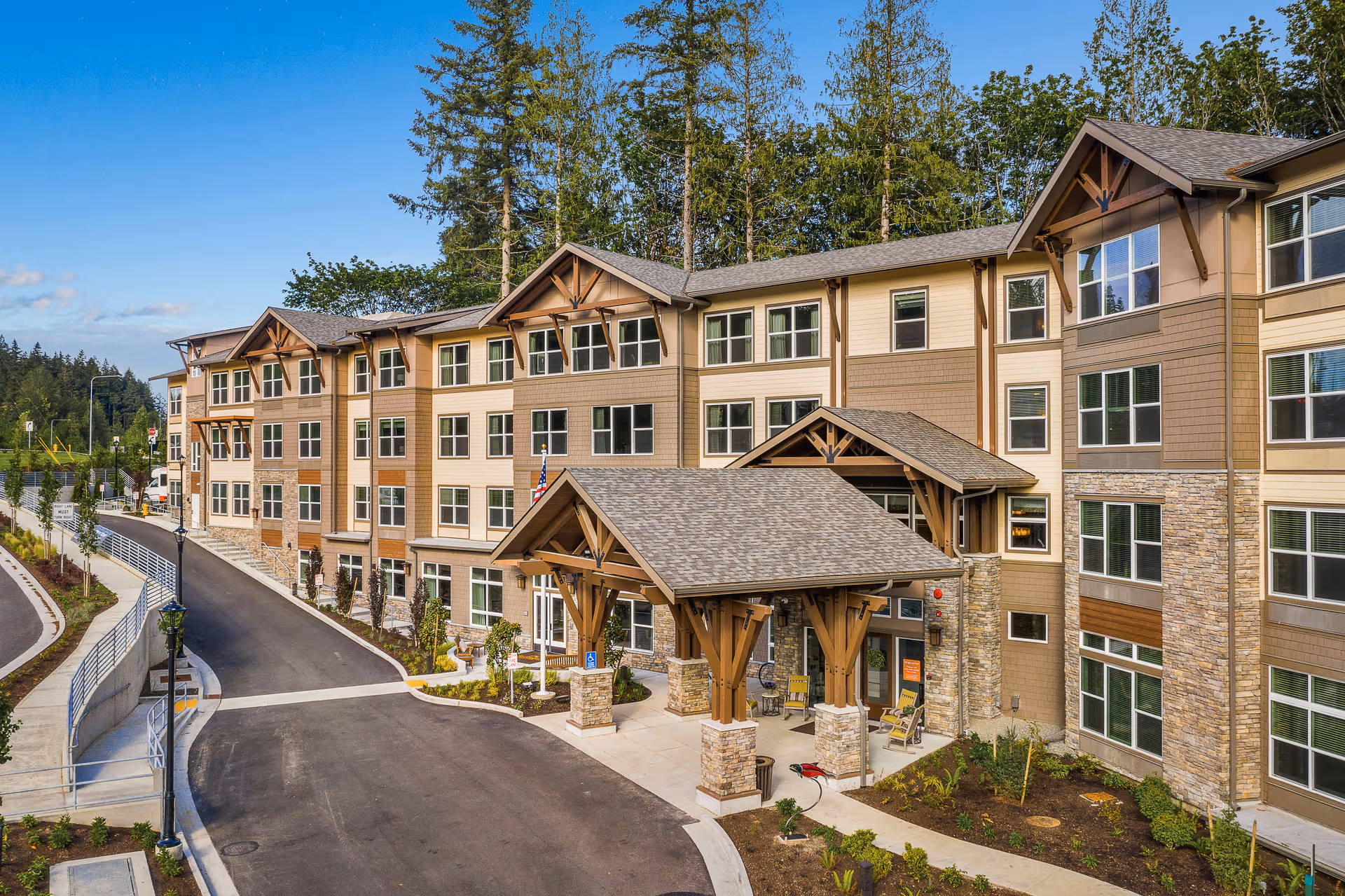 Front exterior of Sunrise of Issaquah with entrance canopy and landscaped grounds